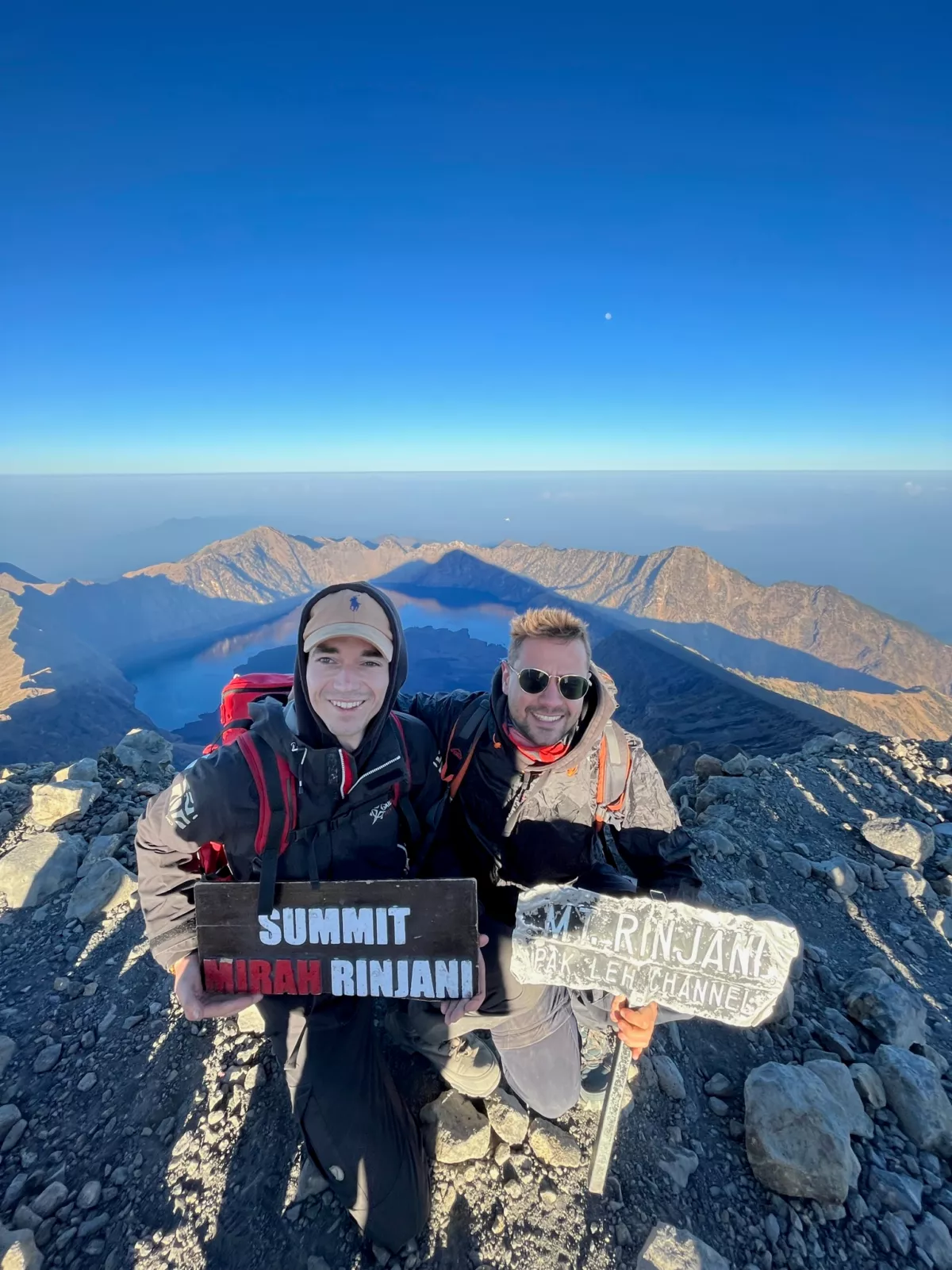 picture of two people climbing a mountain